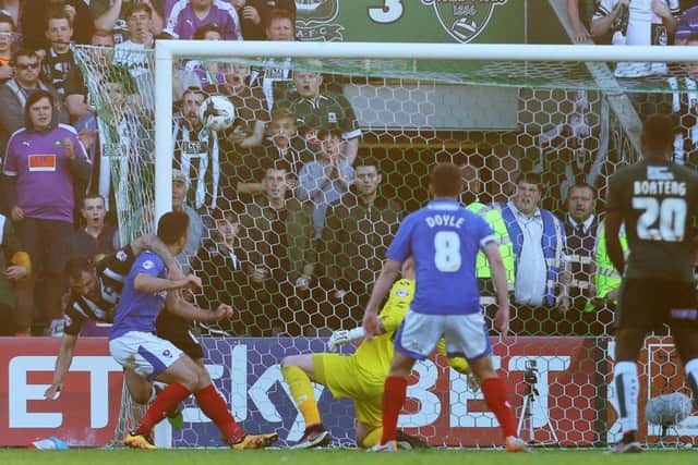 Peter Hartley scores for Plymouth in last season's League Two play-off semi-final second leg. Picture: Joe Pepler