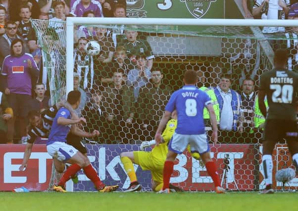 Peter Hartley scores for Plymouth in last season's League Two play-off semi-final second leg. Picture: Joe Pepler