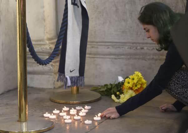 Candles are lit outside the French Embassy in London, following the death of at least 84 people, including several children, after a terrorist drove a truck through crowds celebrating Bastille Day in Nice. 
Picture: Hannah McKay/PA Wire