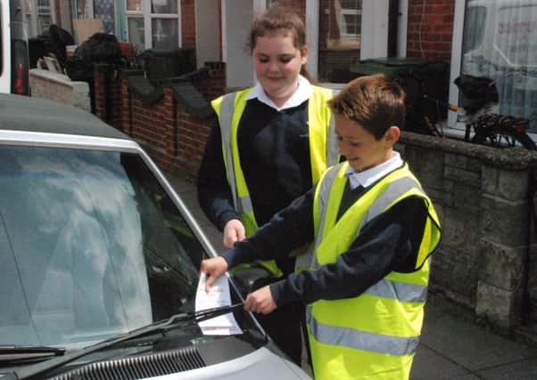 Isambard Brunel Junior School pupils hand out 'parking fines' to help improve road safety around their school