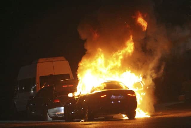 A car burns during firefight between Turkish army and Turkish police, in Istanbul's Taksim square, early Saturday. Picture: AP Photo/Cavit Ozgul TURKEY_Coup_080085.JPG