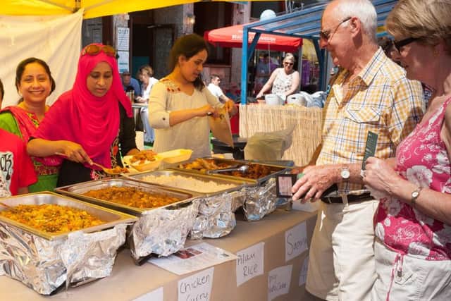 David and Francis Smith served by the lovely staff at the Sultana' Kitchen Stall. Picture Credit: Keith Woodland