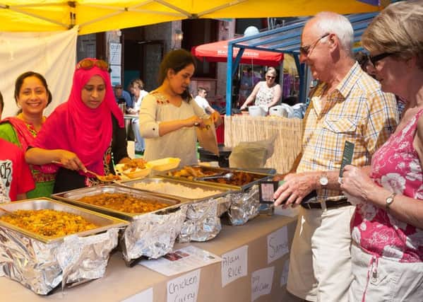 David and Francis Smith served by the lovely staff at the Sultana' Kitchen Stall. Picture Credit: Keith Woodland