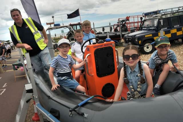 ALL ABOARD Gafirs crew member Rob Winfield with, from left, Ben Terry, seven; Alfie Thompson, eight; Harry Thompson, 10 Picture: Mick Young,