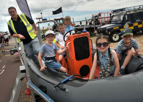 ALL ABOARD Gafirs crew member Rob Winfield with, from left, Ben Terry, seven; Alfie Thompson, eight; Harry Thompson, 10 Picture: Mick Young,