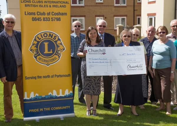 The cheque is presented to Cosham Lions by Churchill Retirement Living