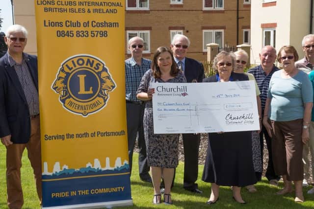 The cheque is presented to Cosham Lions by Churchill Retirement Living