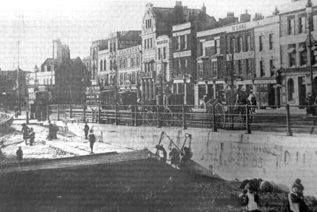 Horse-drawn cabs awaiting customers on The Hard in the 19th century
