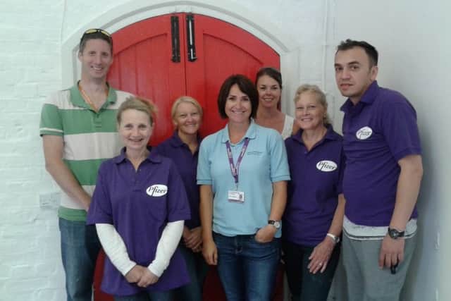 Employees from Pfizer in Havant helped out  with a makeover of the old parcel office at Petersfield train station