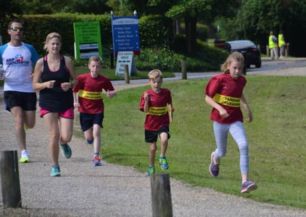 Left to right: Daniel Farmer, Sarah Moulding, Jake Farmer, Oliver Moulding and Jessica Moulding enjoy their Saturday morning parkrun at Fareham on Saturday. Picture: Peter Stoddard