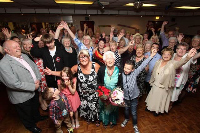 Joyce Taylor with friends and relatives at her party