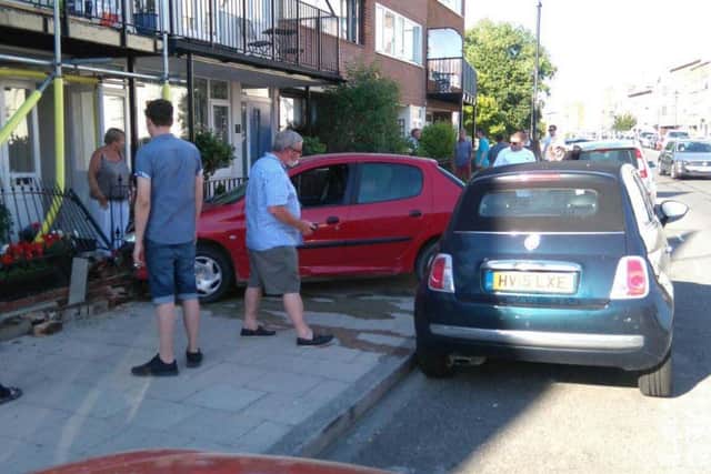 A car has crashed into the front of a home in Old Portsmouth