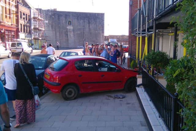 A car has crashed into the front of a home in Old Portsmouth