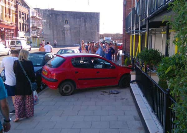 A car has crashed into the front of a home in Old Portsmouth