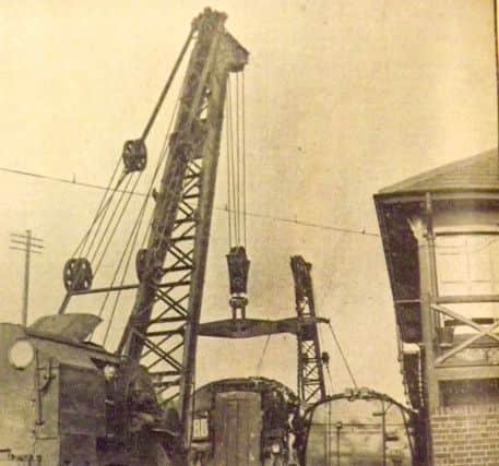 The front carriage of the Waterloo train being lifted after the 1939 crash.