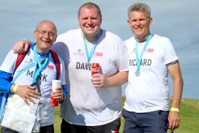 The Hampshire Chamber of Commerce team after successfully completing The Plod, an arduous 40-mile yomp across the South Downs in aid of Action Medical Research