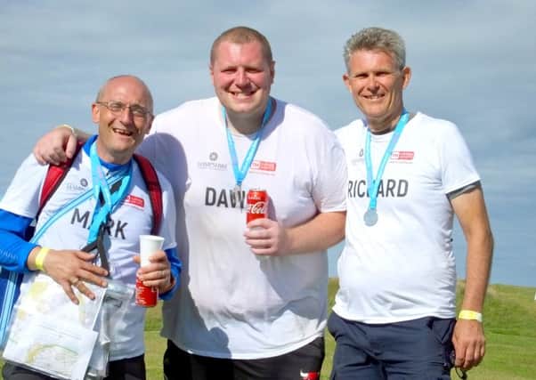 The Hampshire Chamber of Commerce team after successfully completing The Plod, an arduous 40-mile yomp across the South Downs in aid of Action Medical Research