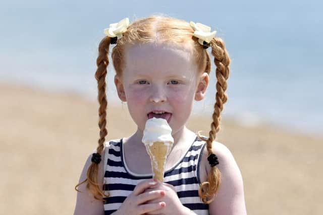 Ruby Elmes, aged 4, enjoys an ice cream on Southsea beach