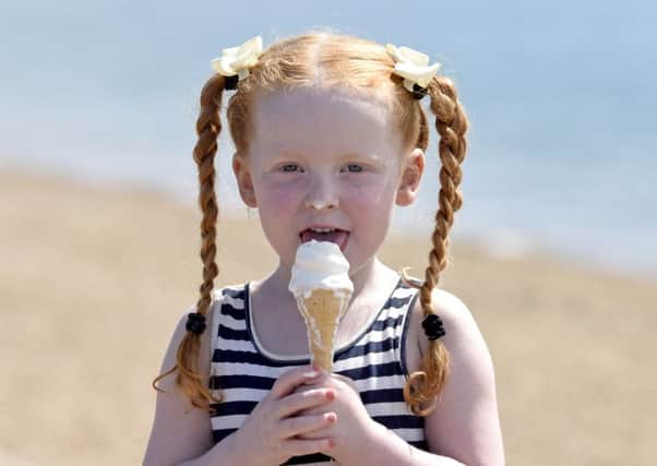 Ruby Elmes, aged 4, enjoys an ice cream on Southsea beach