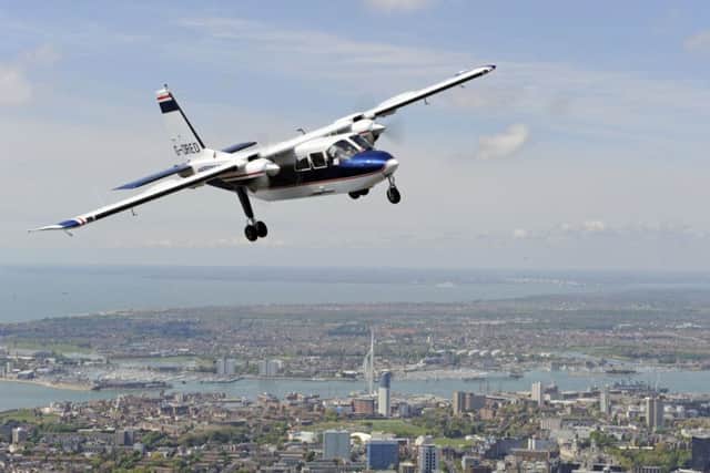 A Britten-Norman Defender aircraft flying over Portsmouth. In the upper right hand corner you see Daedalus Picture: Britten-Norman