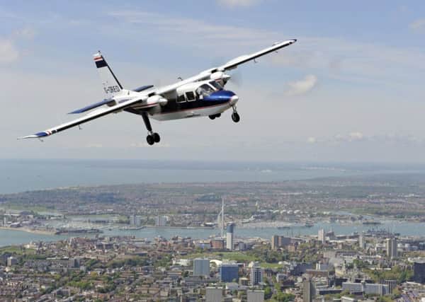 A Britten-Norman Defender aircraft flying over Portsmouth. In the upper right hand corner you see Daedalus Picture: Britten-Norman