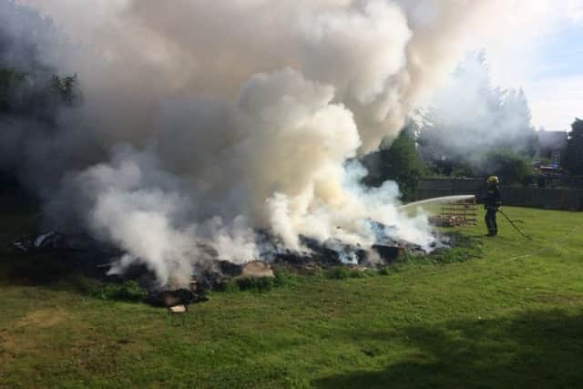 A large fire in Castle Street, Portchester being put out by firefighters PPP-160722-114757001