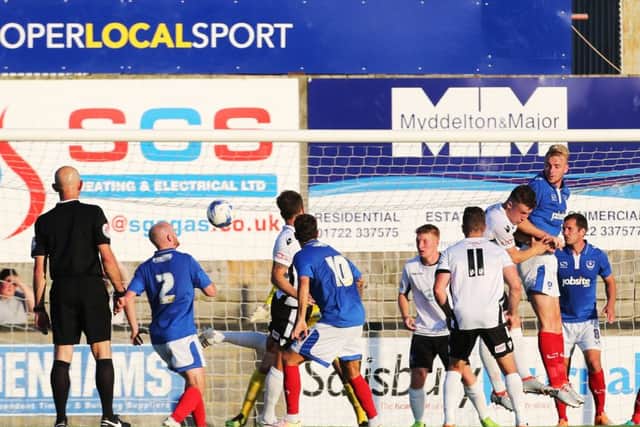 Jack Whatmough rises highest at a corner against Salisbury on Tuesday. Picture: Joe Pepler