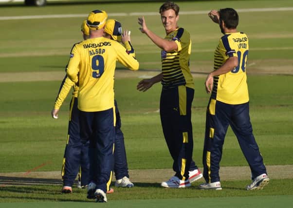 Brad Wheal celebrates one of his three wickets against Middlesex. Picture: Neil Marshall