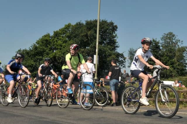 Cyclists set off from the Harvest Home in Denmead Picture: Mick Young (160790-08)