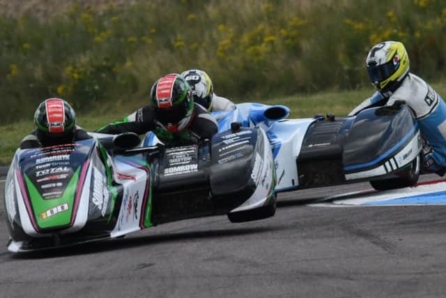 icky Stevens and passenger Ryan Charlwood hold off the challenge of Ben Holland and Lee Watson during the weekends British Formula One Sidecar Championship event at Thruxton Picture: John Mushet