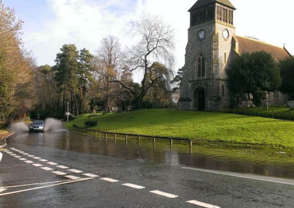 Flooding at the start of the A32 as it joins with School Road, Wickham