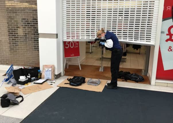 Pictured: Crime scene investigators outside the Wallis store inside the shopping centre. Thieves raided Ernest Jones in Cascades Shopping Centre in Portsmouth on July 26. Picture: Ben Fishwick PPP-160726-142026001