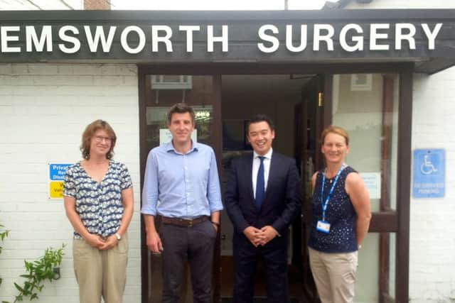 Havant MP Alan Mak with staff from the surgery