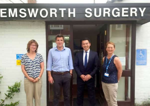 Havant MP Alan Mak with staff from the surgery