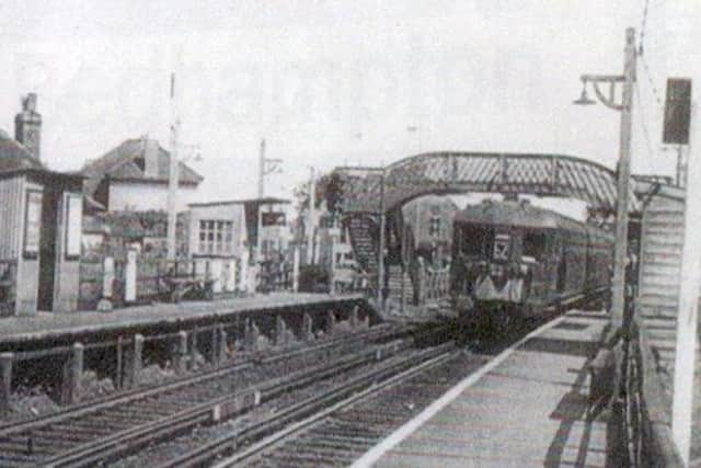 A Brighton train passes through Bedhampton Halt in the 1960s