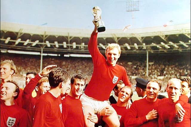 The late Bobby Moore celebrating England's 1966 World Cup win