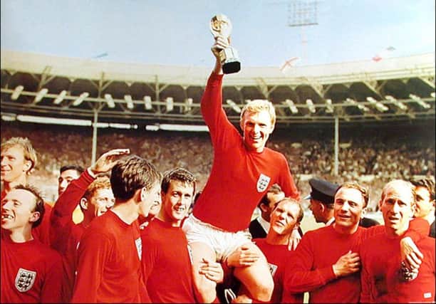 The late Bobby Moore celebrating England's 1966 World Cup win
