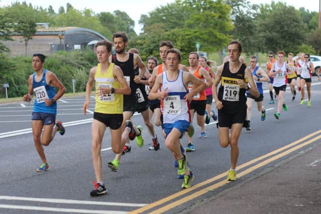 City's Lachlan Wellington on the front at the start of the 5k last night. Picture: David Brawn