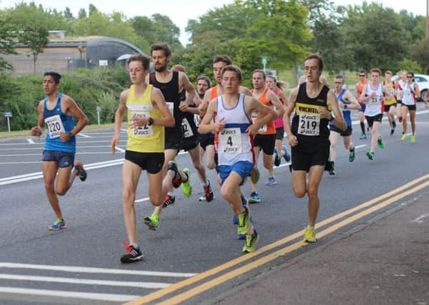 City's Lachlan Wellington on the front at the start of the 5k last night. Picture: David Brawn