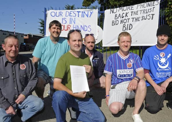 Bob Beech, centre, with his Pompey SOS colleagues protesting outside Pompeys former training ground in Eastleigh in 2012