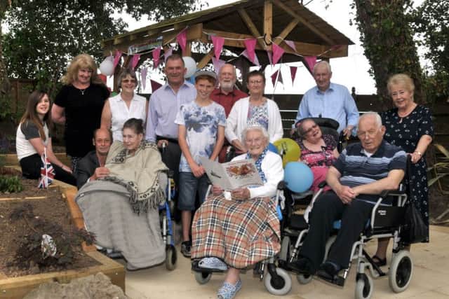 Lily Fielder celebrates her 105th Birthday in the new sensory garden at the Solent Cliffs Nursing Home, with her family and other residents.