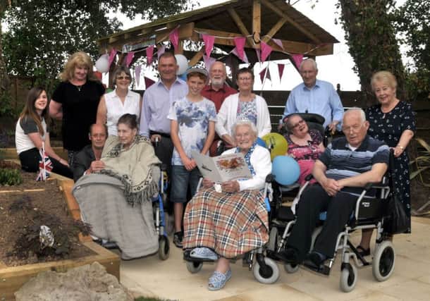 Lily Fielder celebrates her 105th Birthday in the new sensory garden at the Solent Cliffs Nursing Home, with her family and other residents.