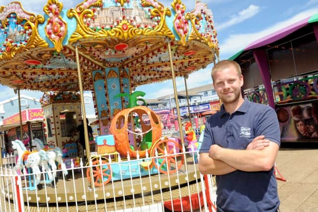 West Manning next to the new kids' carousel at the Clarence Pier funfair