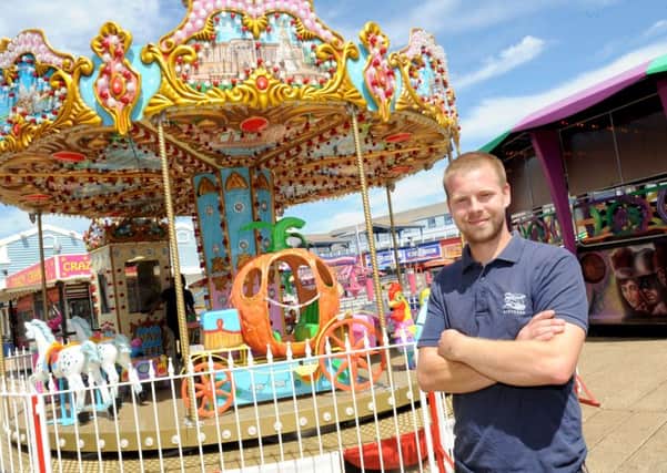 West Manning next to the new kids' carousel at the Clarence Pier funfair