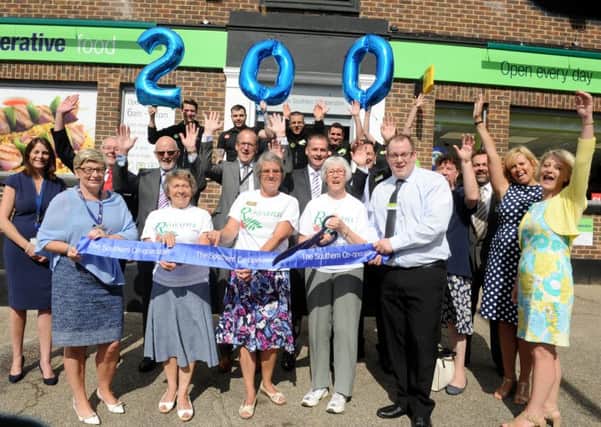 Assistant manager Nick Simms with staff from the Co-op and The Rowans Hospice at the opening of the new Purbrook store 

Picture: Sarah Standing (161112-9874)