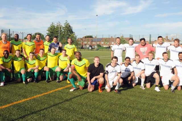 Staff from SSE, left, and Accenture held a charity football match at Park Community School in Havant on Wednesday, raising money for the elderly at Queen Alexandra Hospital Picture: Sarah Standing (161050-9556)