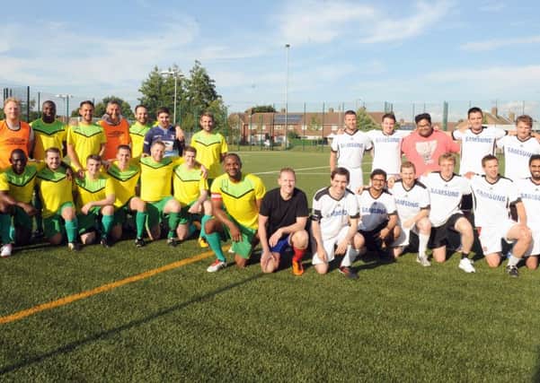 Staff from SSE, left, and Accenture played a charity football match to raise money for elderly patients at Queen Alexandra Hospital