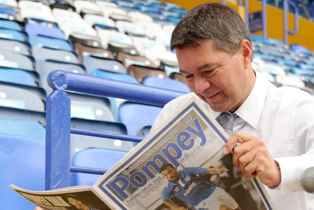Chief executive Mark Catlin reading his copy of the new Pompey magazine Picture: Sarah Standing