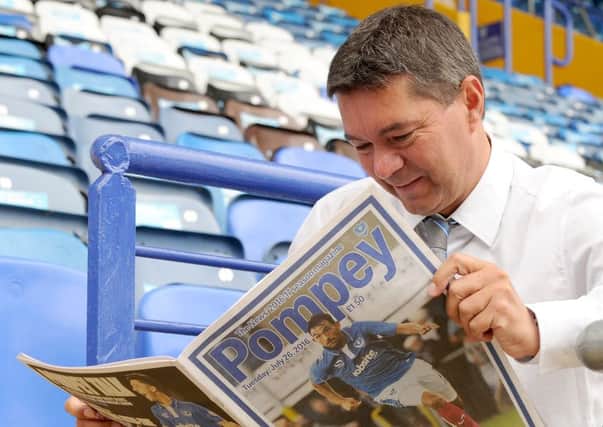 Chief executive Mark Catlin reading his copy of the new Pompey magazine   Picture: Sarah Standing