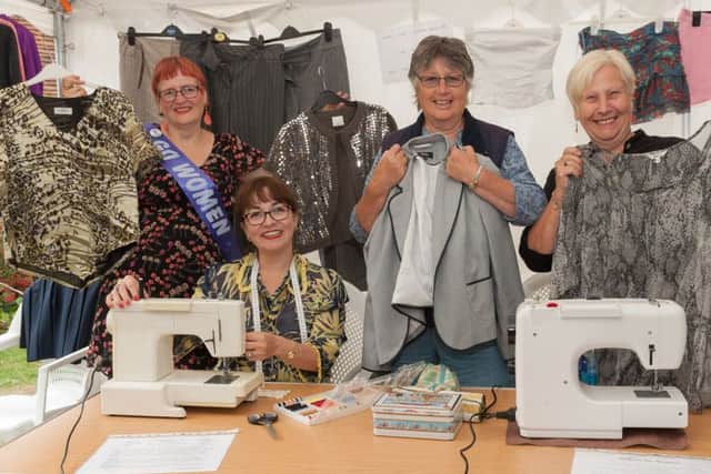 From the left are Tandy Powell, Maria del Carmen Stones, Christine Purton and Penny OCallaghan with some of the items to swap at the Swish Rail and Maria was even making while you wait alterations  Pictures: Keith Woodland (160999-004)